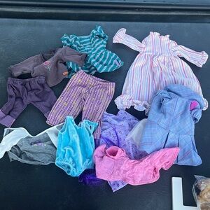 Lot of american girl doll clothes and dogs